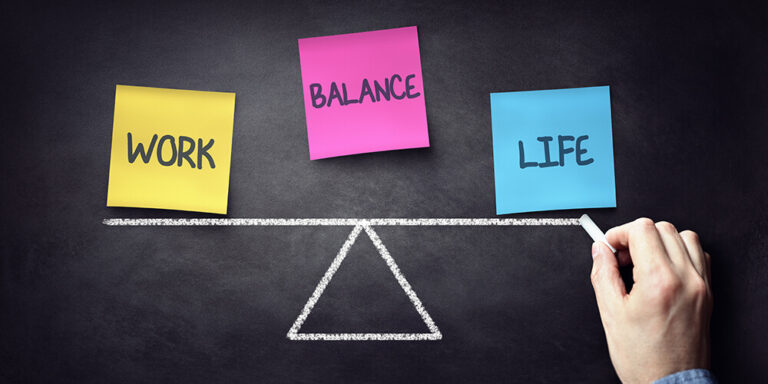 Labels on a balance beam illustrates the concept of work-life balance for lawyers