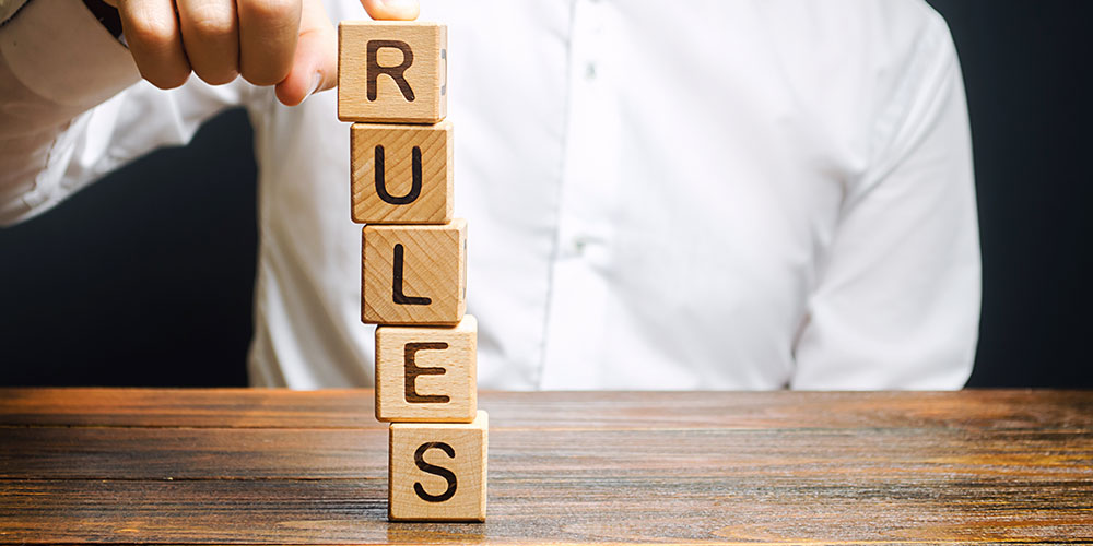 Blocks spell out the word ‘rules’ in this concept photo for the amendments to Rule 30(b)(6)