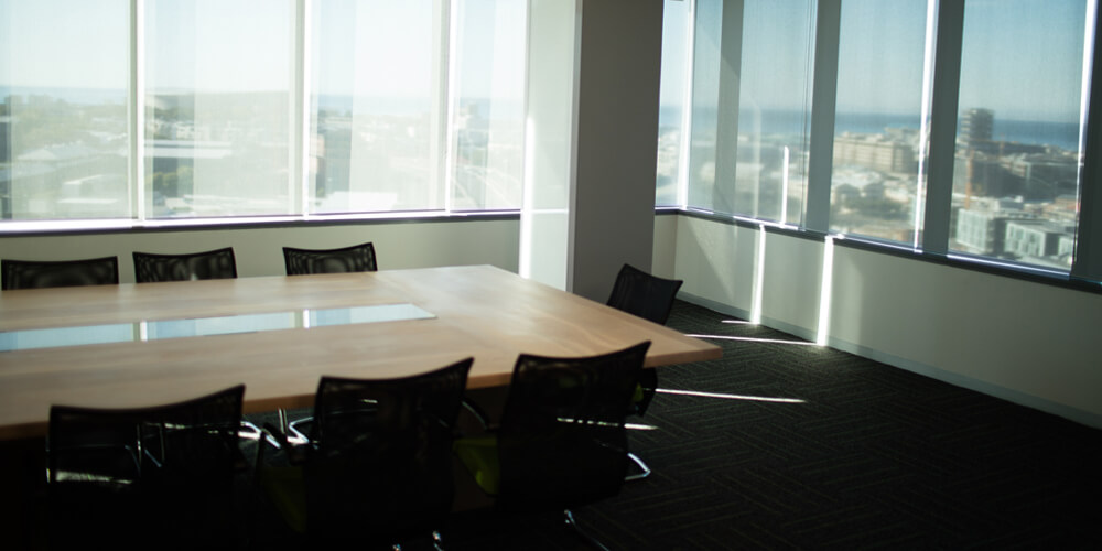 Photo of an empty deposition suite, representing the failure to appear for a deposition.