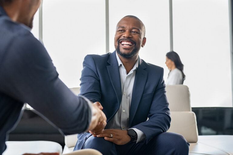 Lawyer shaking hands with happy client