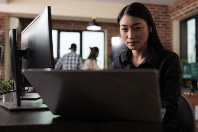 Women using AI software to perform document review