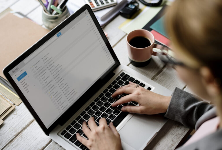 person on laptop checking their email